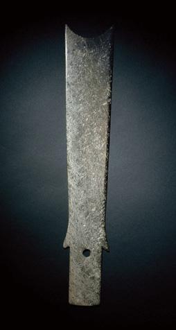 Property from the Yumi Zhai Collection 1297 A GREEN JADE BLADE Neolithic Period, c. 4th-3th Millenium BC 37.5 cm. (14 3 /4 in.