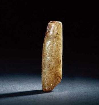 1237 A PALE CELADON JADE TUBULAR BEAD Shang Dynasty (1600-1046 BC) 5.6 cm. (2 1 /4 in.