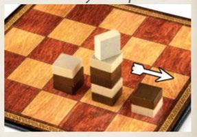 携带 3 枚棋子 在下一个格子上, 白色又留下 2 枚棋子, 仅将最上方 1 枚棋子移至最后的格子